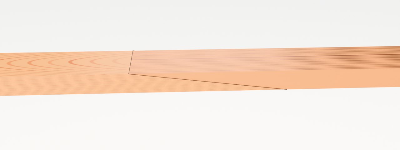 The finished board seen low along its edge: the glue line runs long and shallow between the two boards