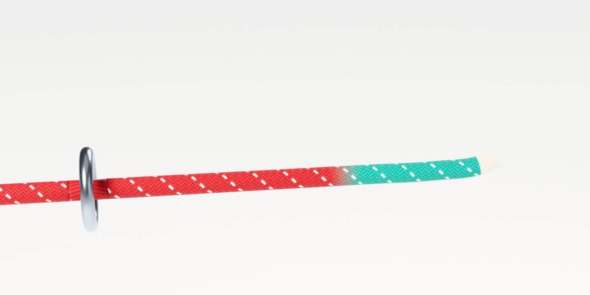 A red rope running through a steel ring, its last few inches marked aqua: the working end